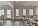 Bright living room with wood floors, lots of windows, and a comfortable sectional sofa at 3003 Evanshire Ave, Duluth, GA 30096