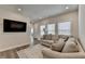 Inviting living room with hardwood floors, abundant natural light, and comfortable seating at 3003 Evanshire Ave, Duluth, GA 30096
