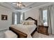 Primary bedroom features tray ceilings, neutral color palette and large windows at 3003 Evanshire Ave, Duluth, GA 30096