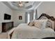 Primary bedroom features tray ceilings, neutral color palette and large windows at 3003 Evanshire Ave, Duluth, GA 30096