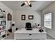 Bright home office featuring great natural light, modern ceiling fan, desk, and bookcase at 3003 Evanshire Ave, Duluth, GA 30096