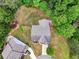 Aerial view showcases the roof, landscaping, and overall layout of the property and surrounding neighborhood at 3215 Trowbridge Dr, Cumming, GA 30040