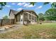 Grassy backyard showcasing a screened-in porch perfect for outdoor entertaining at 3215 Trowbridge Dr, Cumming, GA 30040