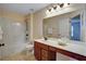 Neutral bathroom with a tub and shower combination, vanity, sink and a large mirror at 3215 Trowbridge Dr, Cumming, GA 30040