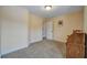 Spare bedroom with neutral carpet, a desk and a door leading to another room at 3215 Trowbridge Dr, Cumming, GA 30040