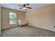 Spare bedroom with a white crib situated beneath a window providing natural light at 3215 Trowbridge Dr, Cumming, GA 30040