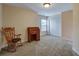 Spare bedroom with an antique roll top desk and rocking chair for a home office or study area at 3215 Trowbridge Dr, Cumming, GA 30040