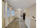 Well-lit hallway with carpet flooring, neutral walls, and access to other rooms at 3215 Trowbridge Dr, Cumming, GA 30040