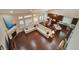 Open concept living room boasts hardwood floors, a fireplace and adjoins an eat-in kitchen and dining area at 3215 Trowbridge Dr, Cumming, GA 30040