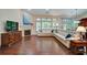 Spacious living room with hardwood floors, fireplace, and ample natural light at 3215 Trowbridge Dr, Cumming, GA 30040