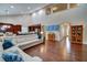Open living space boasts hardwood floors, ample seating, and seamless connection to the kitchen at 3215 Trowbridge Dr, Cumming, GA 30040