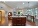 Open concept living area with kitchen view and granite breakfast bar for extra seating at 3215 Trowbridge Dr, Cumming, GA 30040