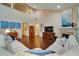 Spacious living room with high ceilings, hardwood floors, a fireplace, and lots of natural light at 3215 Trowbridge Dr, Cumming, GA 30040