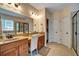 Bright main bathroom featuring a walk-in shower, soaking tub, double vanity, and natural light at 3215 Trowbridge Dr, Cumming, GA 30040