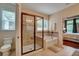 Beautiful bathroom featuring tile flooring, a walk-in shower, a soaking tub, and natural light at 3215 Trowbridge Dr, Cumming, GA 30040