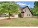 A beautiful residence with a two-car garage and an abundance of beautiful green trees at 3215 Trowbridge Dr, Cumming, GA 30040