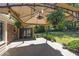 Relax on the wooden back deck, covered by a canopy and decorated with hanging ferns and garden at 4350 Bonaparte Dr, Tucker, GA 30084