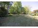 This spacious backyard features mature trees, a play set, and ample green space for outdoor activities at 4350 Bonaparte Dr, Tucker, GA 30084