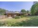 Enjoy the expansive backyard, complete with a canopy-covered deck and lush green landscaping at 4350 Bonaparte Dr, Tucker, GA 30084