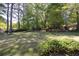 Enjoy the peaceful backyard with mature trees, a lush lawn, and plenty of shade for outdoor relaxation at 4350 Bonaparte Dr, Tucker, GA 30084