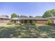 A well-manicured lawn defines the backyard, showcasing its garden, patio, and overall charm at 4350 Bonaparte Dr, Tucker, GA 30084