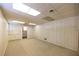 Unfinished basement featuring carpeted flooring and white paneled walls at 4350 Bonaparte Dr, Tucker, GA 30084