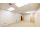Unfinished basement with carpeted flooring and a paneled accent wall at 4350 Bonaparte Dr, Tucker, GA 30084