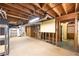 Unfinished basement with exposed wood and unfinished ceiling at 4350 Bonaparte Dr, Tucker, GA 30084