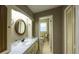 Bathroom featuring a vanity with cabinet storage, a mirror, and a toilet at 4350 Bonaparte Dr, Tucker, GA 30084