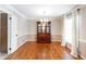 Formal dining room features hardwood floors, a chandelier, and elegant wallpaper at 4350 Bonaparte Dr, Tucker, GA 30084