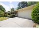 Wide driveway and landscaping of this one-story home leading up to the two car garage and brick exterior at 4350 Bonaparte Dr, Tucker, GA 30084
