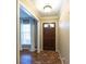 Home foyer featuring a brick floor design and traditional front door at 4350 Bonaparte Dr, Tucker, GA 30084