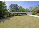 Charming brick ranch home with manicured lawn, a front porch, an attached two-car garage and mature trees at 4350 Bonaparte Dr, Tucker, GA 30084