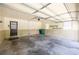 Clean garage with a utility door, electrical garage door, shelving and two small windows for natural light at 4350 Bonaparte Dr, Tucker, GA 30084