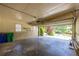 Spacious garage with shelving, an electrical garage door opener, utility door and a view of the yard at 4350 Bonaparte Dr, Tucker, GA 30084