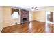 Comfortable living room with a brick fireplace, hardwood floors, and natural light at 4350 Bonaparte Dr, Tucker, GA 30084