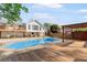 Inviting backyard with a large in-ground pool, wooden deck, and outdoor seating area at 1834 Kimberly Sw Dr, Marietta, GA 30008