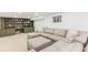 Finished basement with olive green cabinets and shelving, and a sectional sofa at 1834 Kimberly Sw Dr, Marietta, GA 30008