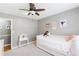 Bright bedroom with a single bed, ceiling fan, and charming decor at 1834 Kimberly Sw Dr, Marietta, GA 30008