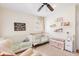 Lovely Bedroom with two cribs, a reading nook, and a light-filled window with white shutters at 1834 Kimberly Sw Dr, Marietta, GA 30008