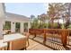 Outdoor deck with patio table and seating with a view of the fenced-in backyard at 1834 Kimberly Sw Dr, Marietta, GA 30008