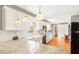 Modern kitchen with granite countertops, white cabinetry, and stainless steel appliances at 1834 Kimberly Sw Dr, Marietta, GA 30008