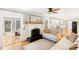 Open concept living space with a fireplace, hardwood floors, and lots of natural light at 1834 Kimberly Sw Dr, Marietta, GA 30008