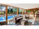 Covered patio with comfortable seating area overlooking the in-ground pool and backyard at 1834 Kimberly Sw Dr, Marietta, GA 30008