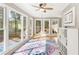 Sunroom featuring lots of windows, bright space, and hardwood flooring at 1834 Kimberly Sw Dr, Marietta, GA 30008