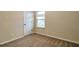 Bedroom featuring a window and a door at 2513 Shropshire Pl, Mcdonough, GA 30253