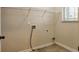 A practical laundry room with convenient shelving and connections at 2513 Shropshire Pl, Mcdonough, GA 30253