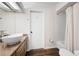 Bathroom with wood floors, granite countertops, vessel sink, and shower/tub combo at 4030 Muirfield Ln, Marietta, GA 30068