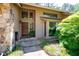 The front exterior features stone accents, a dark wood door, and beautifully landscaped yard at 4030 Muirfield Ln, Marietta, GA 30068