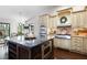 Eat-in kitchen island with stainless appliances, granite counters and hardwood floors open to outdoor space at 4030 Muirfield Ln, Marietta, GA 30068